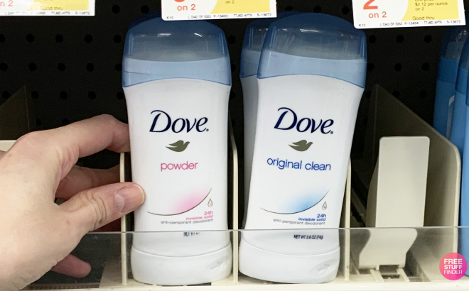 Hand Holding Dove Deodorant Stick