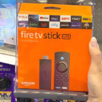 Hand Holding Fire TV Stick Lite