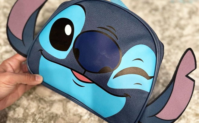 Hand Holding a Disney Stitch Kids Dual Compartment Lunch Bag