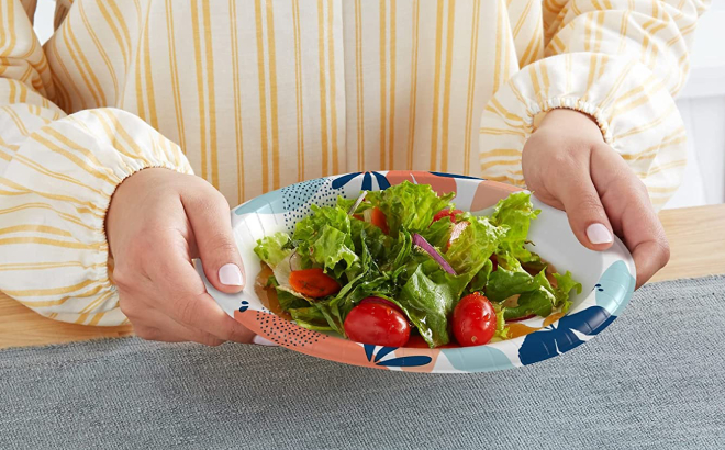 Lady Holding a Dixie Paper Plate with Salad