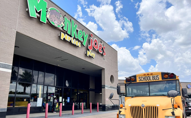 Monkey Joes Storefront with a School Bus in Front