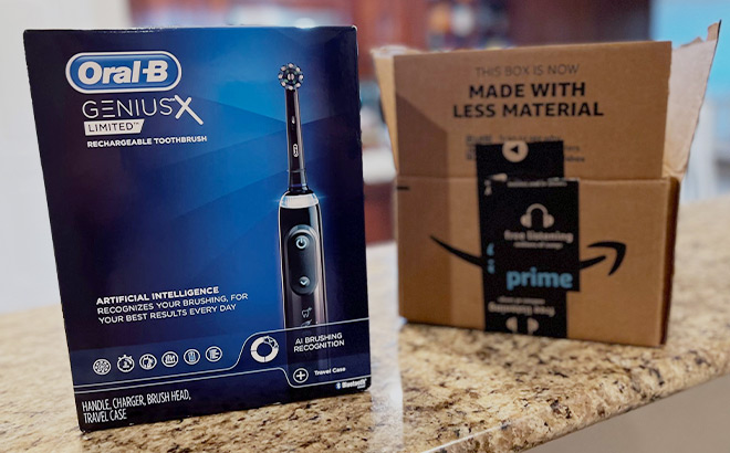 Oral B Genius X Limited Toothbrush next to a Prime Day Box on a Countertop