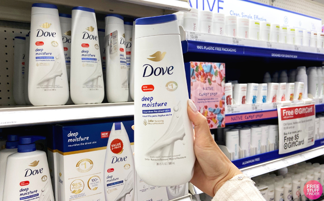 Person Holding a Bottle of Dove Deep Moisture Body Wash