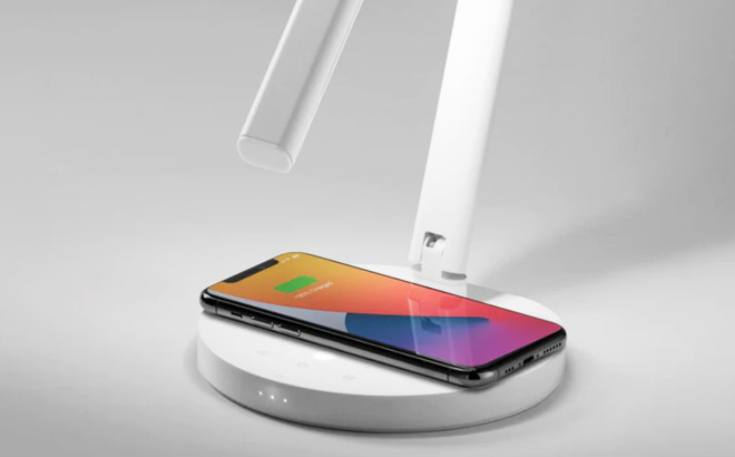 Phone Placed on the Wireless Charger of the Desk Lamp