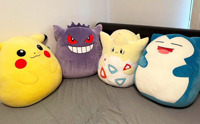 Pokemon Squishmallows on a Bed