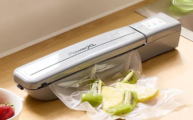 PowerXL Duo NutriSealer Food Vacuum Sealer on a Wooden Table