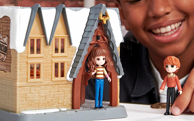 a Boy Playing with a Harry Potter Minis Playset