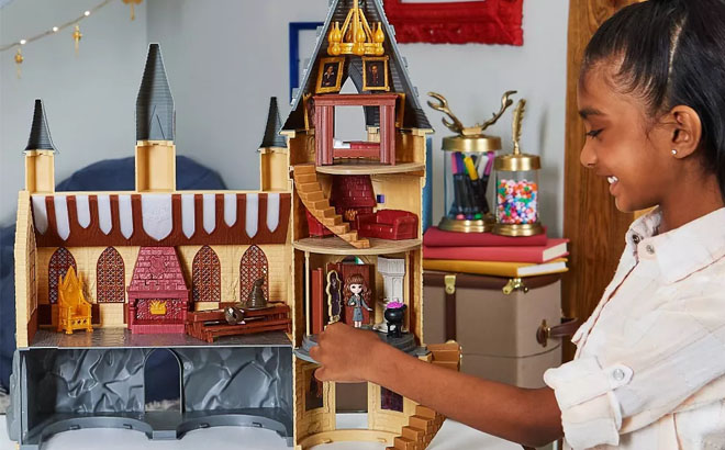 a Girl Playing with a Harry Potter Magical Minis Hogwarts Castle Playset