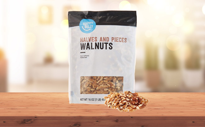 a Pack of Happy Belly California Walnuts Halves and Pieces on a Wooden Table