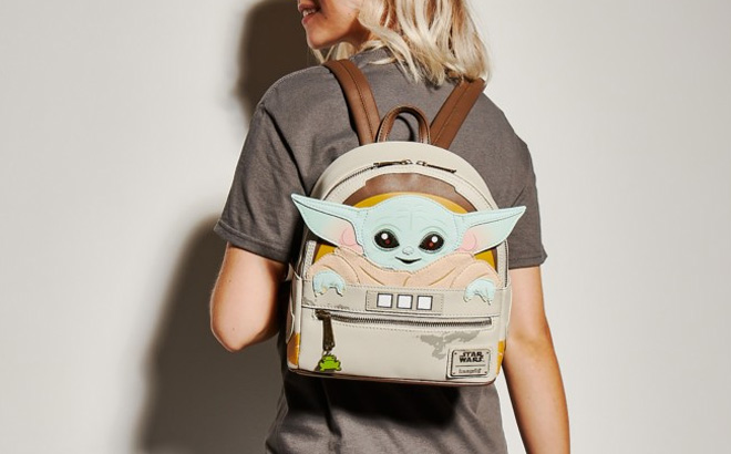 a Woman Carrying a Loungefly Star Wars Mini Backpack