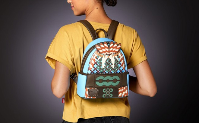 a Woman with a Loungefly Black Panther Wakanda Forever Mini Backpack