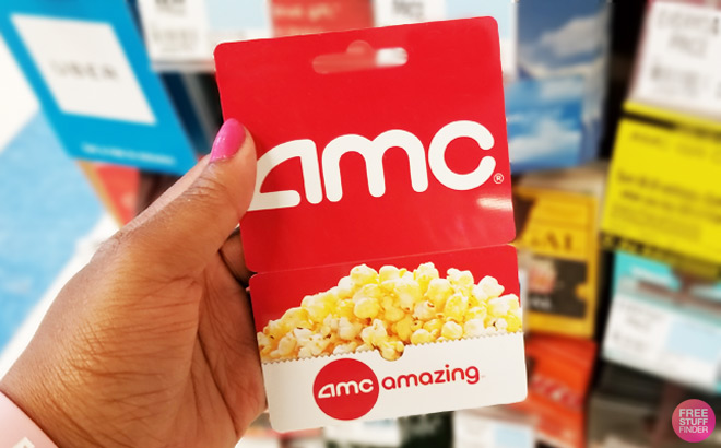 A Hand Holding AMC Gift Card