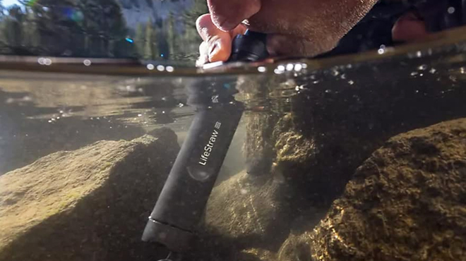 A Man Drinking Water with LifeStraw Peak Series