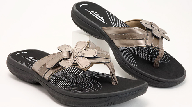 A Pair of Clarks Cloudsteppers Floral Sport Thong Sandals