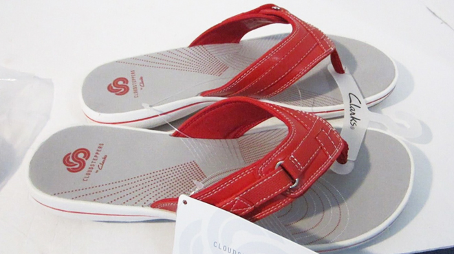 A Pair of Clarks Cloudsteppers Sport Thong Sandals in Red Color