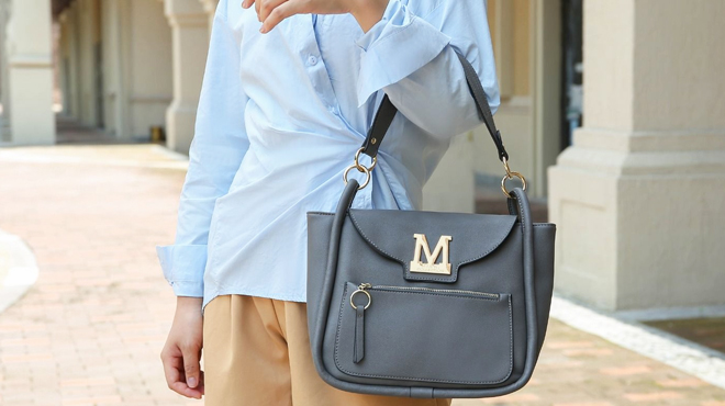 A Woman Carrying MKF Chloy Hobo Bag in Denim Color