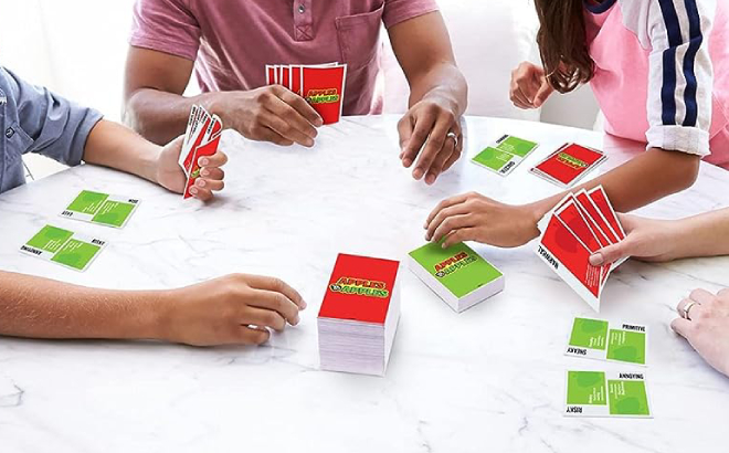 Family Paying with Apples to Apples Card Game