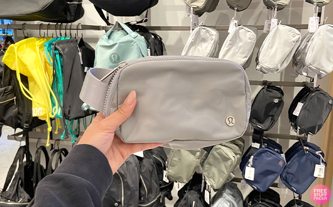 Hand Holding Lululemon Everywhere Belt Bag in Silver Drop