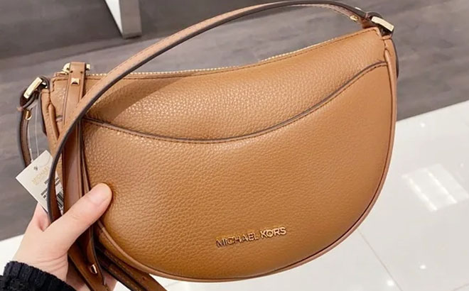 Hand Holding Michael Kors Dover Small Leather Crossbody Bag