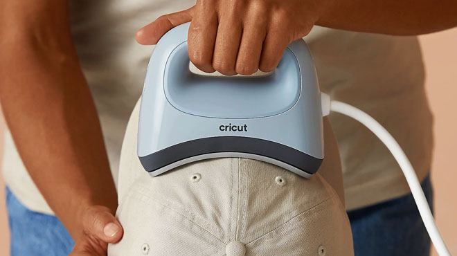 Hand Holding a Cricut Hat Press