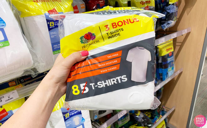 Hand Holding a Pack of Fruit of the Loom Boys White Crew T Shirt