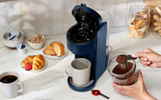 Hand Pouring Coffee in the Instant Solo Single Serve Coffee Maker