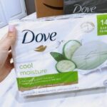 Hand holding Dove Cool Moisture Beauty Bar Soap Cucumber and Green Tea 14 Pack