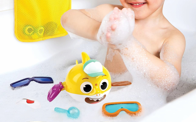 Little Boy Playing with Baby Shark Bath Swimmer Toys