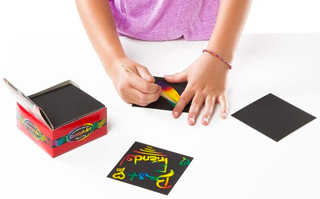 Melissa Doug Scratch Art Rainbow Mini Notes With Wooden Stylus on a white table