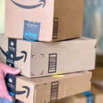 Mr FSF holding Amazon boxes