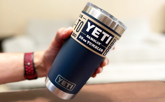 Person Holding a Navy YETI Rambler 20 Oz Tumbler