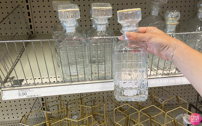 Person Holding a Rectangular Decanter