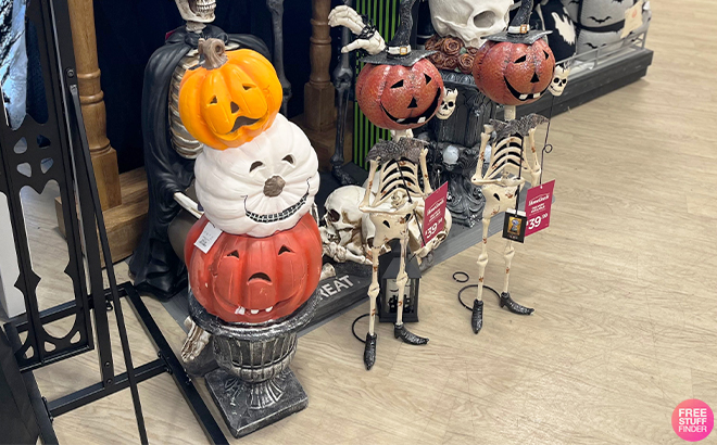 Stacked Jack O Lanterns On Pedestal 35 Inches and Pumpkin Head Skeleton at Home Goods