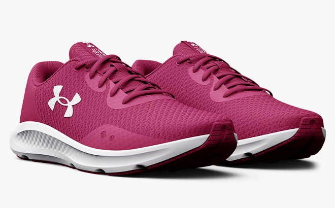 Under Armour Charged Running Shoes for Women on a light gray background