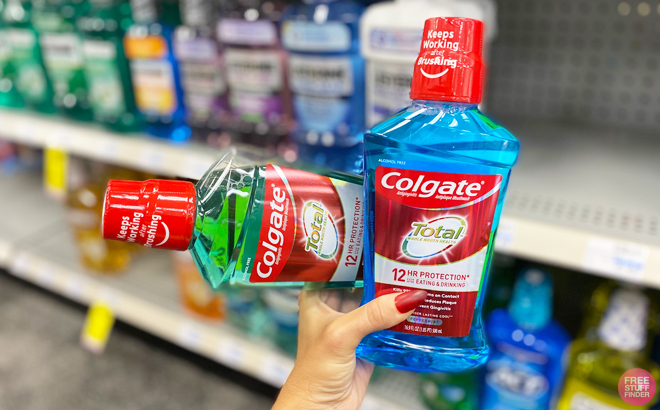 Woman Holding Two Colgate Mouthwash at CVS