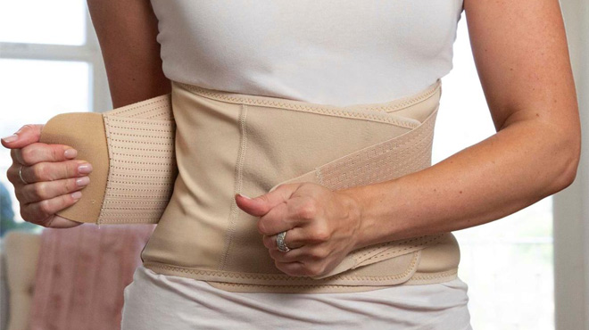 Woman Wearing Copper Fit Core Shaper Deluxe Adjustable Back Support Belt