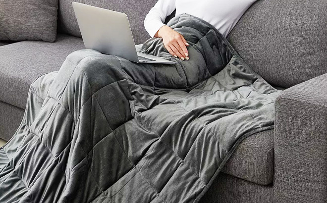 Woman is Covered With Altavida Weighted Blanket in Gray Color