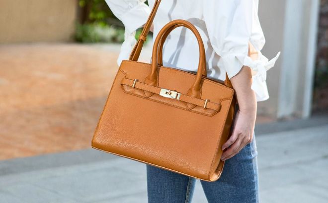 Woman is Wearing a Calla Vegan Leather Womens Satchel Bag in Brown color