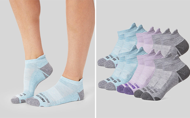 Woman wearing 6 Pack Ankle Running Socks Next to a Collection of the Same Socks