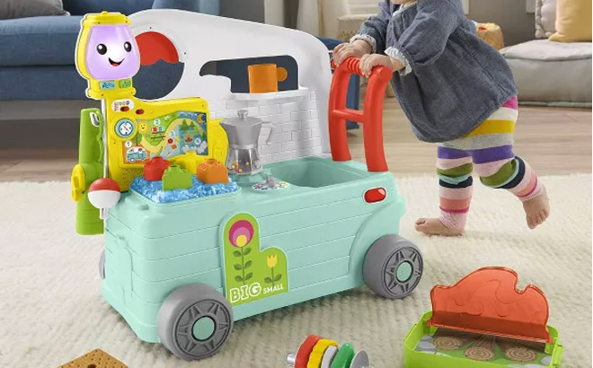 a Baby Playing with a Fisher Price Laugh Learn 3 In 1 On The Go Camper