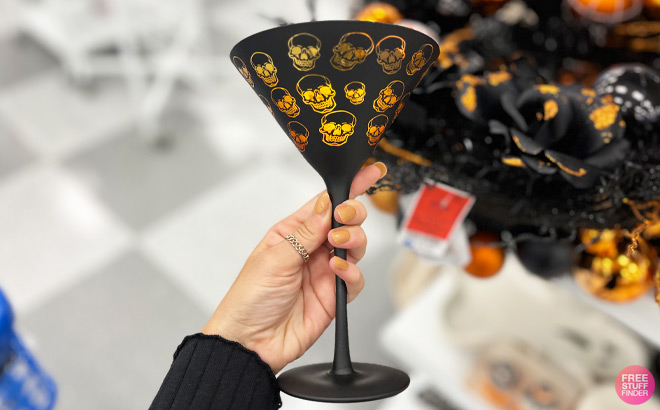a Hand Holding Halloween Cocktail Glass