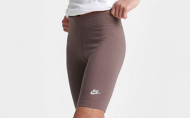 an Image of a Persons Lower Body Wearing Nike Girls Sportswear High Waisted Bike Shorts