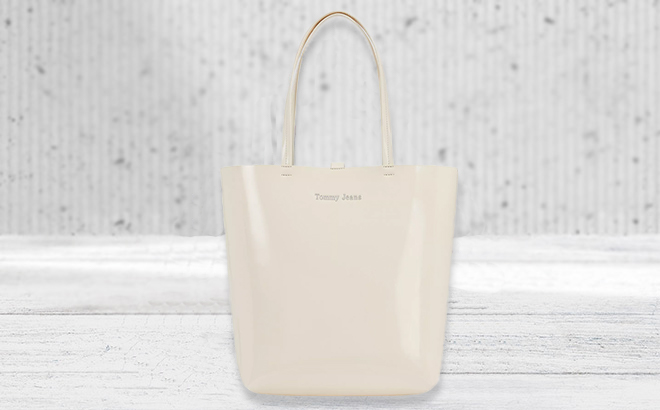 tj gloss tote on a neutral background