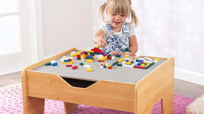 A Girl Playing with Building Blocks on KidKraft Activity Table