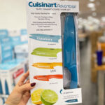 A Hand Holding Cuisinart 10 Piece Ceramic Coated Knife Set