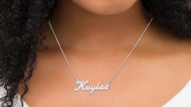 A Woman Wearing Zales Personalized Name Necklace in Sterling Silver