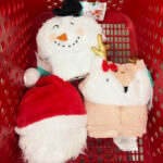 All Three Pillowfort Christmas Blankets in a Target Shopping Cart