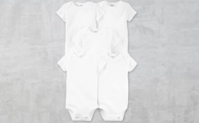 Carters Baby 5 Pack Short Sleeve Bodysuits on Cement Background