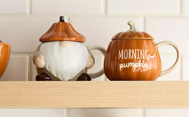 Celebrate Together Fall Harvest Gnome Mug on the Left Side and Fall Morning Pumpkin Mug on the Right Side