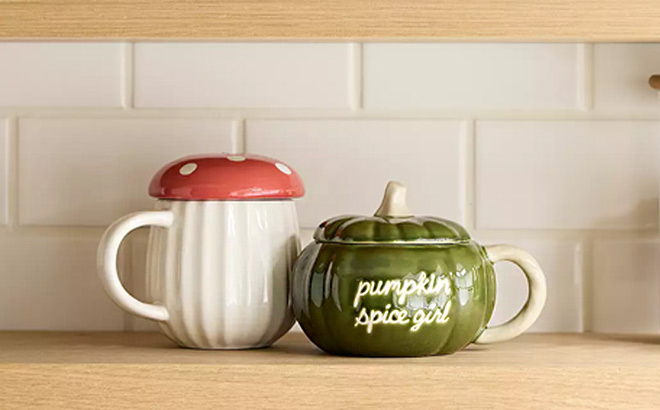 Celebrate Together Fall Lidded Mushroom Mug on the Left and Pumpking Spice Girl Mug on the Right Side